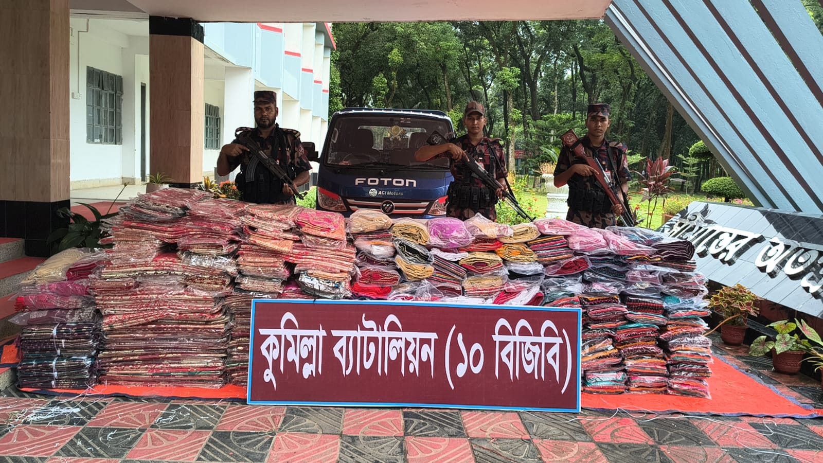 Indian sarees, blouses, and maxis worth approximately Tk 75 lakh, along with a vehicle, seized during a BGB operation at the Comilla border.